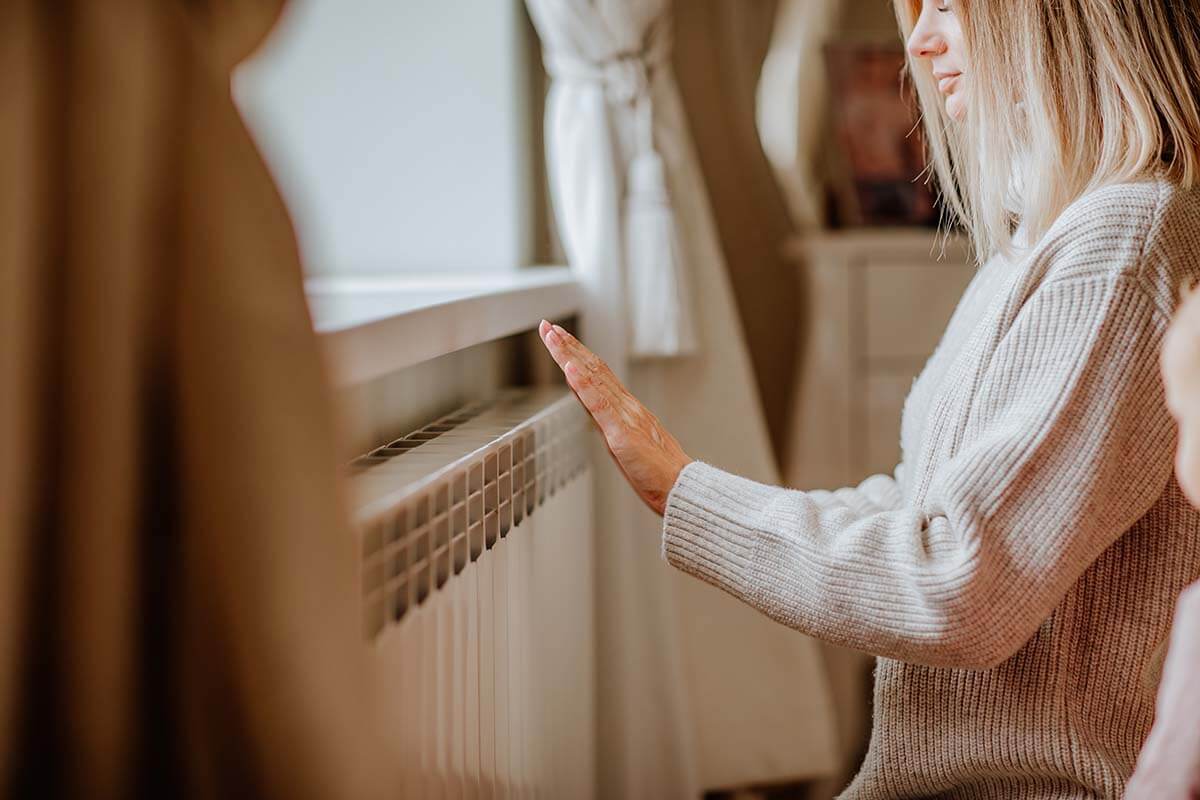 Young woman in long winter beige sweater